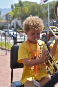 child playing musical instrument