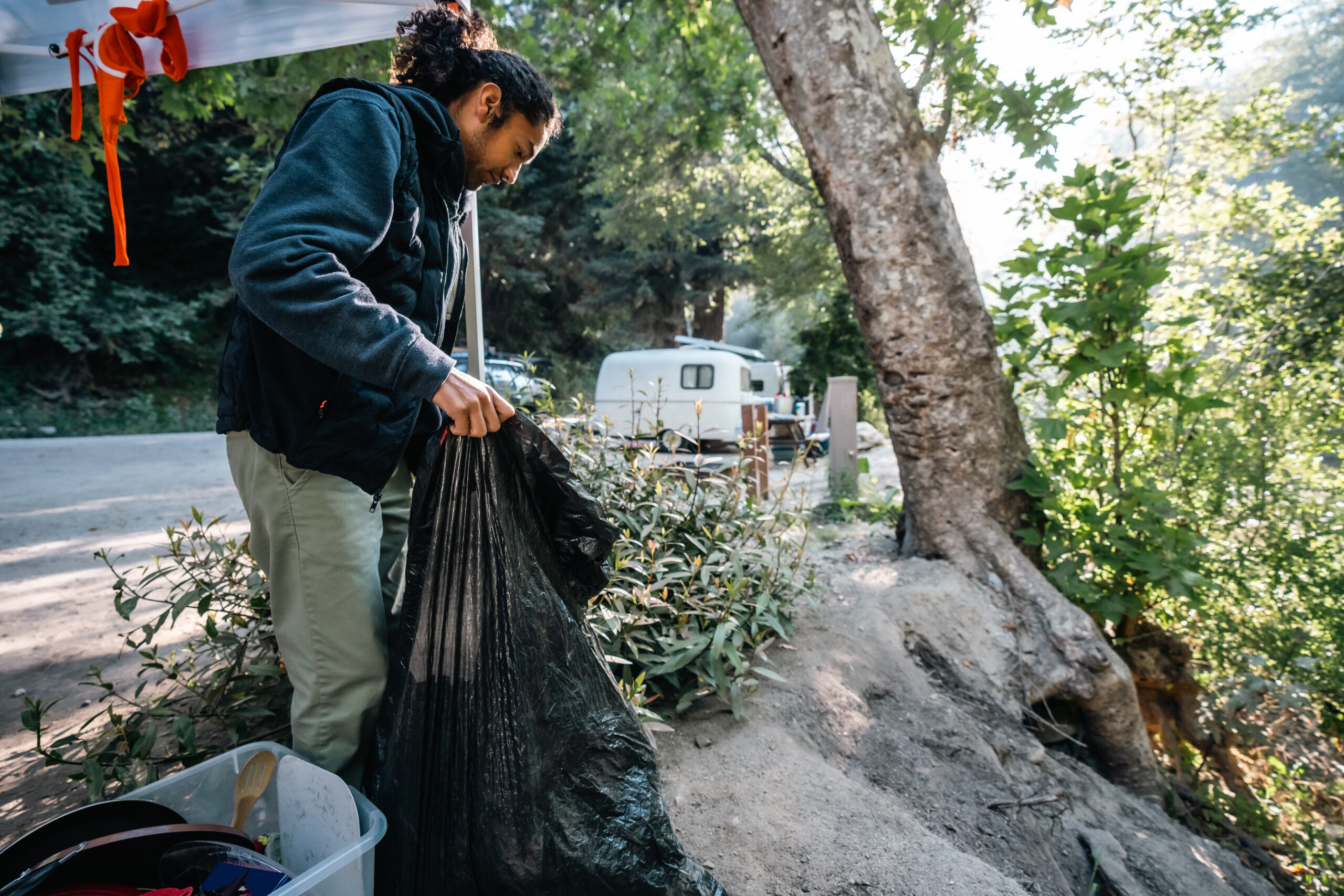 Male Camper Cleaning Up